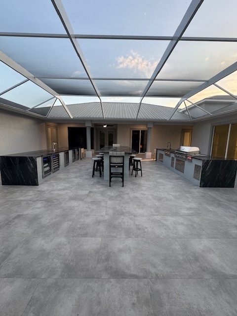 Full outdoor kitchen renovation in Cape Coral with a kitchen build out, tile and granite installation