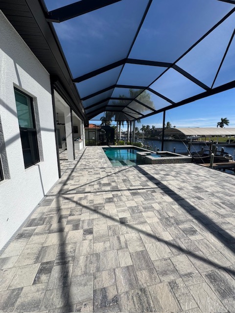 A fresh paver patio in cape coral- Cleaned, pressure washed, and sealed by All In One Property Care